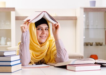 Wall Mural - Female student in hijab preparing for exams