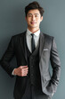 © N. W. - happy young and handsome asian business man in a suit