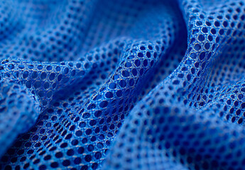 Blue sports jersey fabric with mesh texture, macro photography