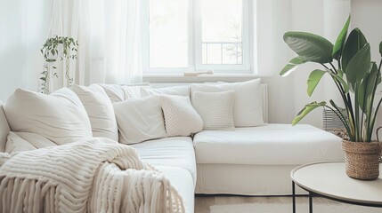 Poster - A white couch with white pillows in a minimal living room.