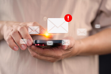Poster - Young man using a smartphone receives a new email notification, highlighting the email and internet communication, data, digital marketing, e-mail icon technology and online networking concept.