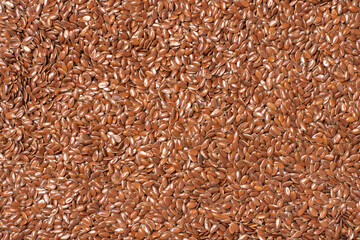 Poster - Linseed or flaxseed background, brown flax seeds. Top view, flat lay.