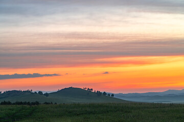 Wall Mural - landscape of grassland and mountain under twilight