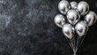 © Salander Studio - a horizontal banner with a bunch of shiny silver balloons on a black surface