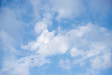 Wall Mural - Sky background with clouds. White clouds against a blue sky.