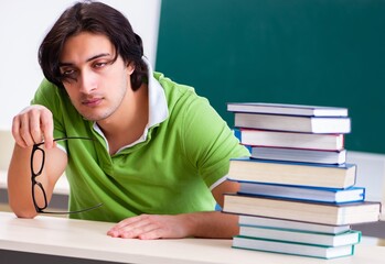 Sticker - Young male student in front of green board