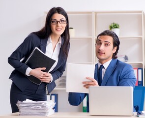 Poster - Two employees working in the office