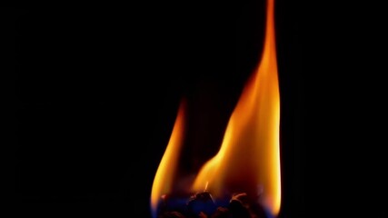 Wall Mural - a captivating close up of a flame, showcasing dynamic motion and vibrant colors in a dramatic atmosp