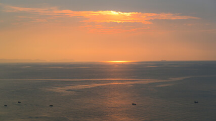 Wall Mural - beautiful view of golden sea and sky in the evening, natural background