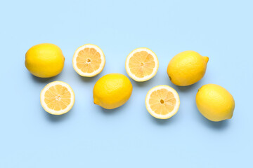 Wall Mural - Composition with fresh lemons on blue background