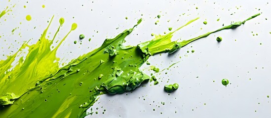 Wall Mural - Vibrant green paint splatters on a white backdrop