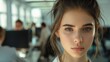 © Darcraft - Close-up portrait of a young Hungarian female manager with a professional expression, in a modern office setting.