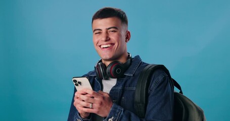 Poster - Student, phone and laugh with portrait, funny joke or meme on blue background for social media. Smile, happy and young gen z man reading from app on smartphone with website for communication mockup