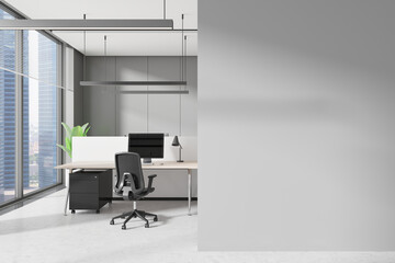 Poster - Grey workplace interior with pc monitors on tables in row, window. Mockup wall