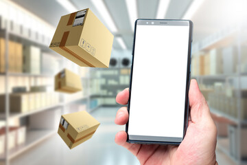Poster - Hand with phone inside warehouse. Smartphone with white screen. Flying parcels. Phone inside cold storage warehouse. Space for application storage. Copy space for warehouse website.