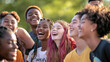 © Luluraschi - A vibrant group photo featuring a diverse group of young people smiling and laughing together, symbolizing unity and diversity on International Youth Day