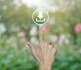 Poster - Hand pressing download flat icon over blur pink flower and tree in park, Technology internet online concept