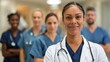 © Intelligent Horizons - Diverse group of healthcare professionals including doctors nurses and other staff standing together in a hospital hallway smiling and appearing friendly and positive