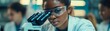 © YOGI C - Young Black Scientist Uses Microscope in Laboratory