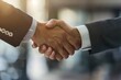 © Shutter2U - Two businessmen shaking hands in agreement, symbolizing partnership and success.