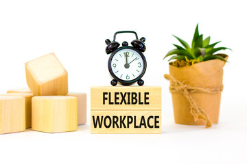 Flexible workplace symbol. Concept words Flexible workplace on beautiful wooden block. Beautiful white paper background. Black alarm clock. Business Flexible workplace concept. Copy space.