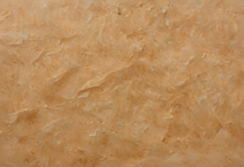 A textured background featuring crumpled, wrinkled paper in warm beige tones. The surface has a natural, organic feel, ideal for artistic or design purposes.