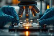 © sornthanashatr - A pair of scientists are looking at a cell under a microscope