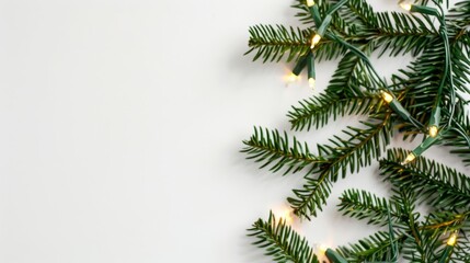 Wall Mural - Sparkling Christmas lights tangled among green pine branches isolated on a white background 