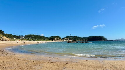 Beach on a small bay with tropical ocean