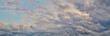 © Rejdan - Dramatic cloudy sky on a fall evening. Panoramic sky photo, natural texture of clouds