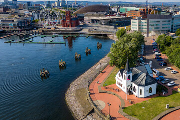 CARDIFF,WALES - JULY 29 2024: Aerial view of the Norwegian Church, Welsh Government, Pierhead and other landmarks in Cardiff Bay