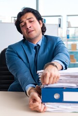 Wall Mural - Chained male employee unhappy with excessive work