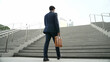 © Summit Art Creations - Top view of smart business man walking up stairs with bag in the hand. Professional project manager climb up the stair and going to workplace. Increasing skill, getting promotion, traveling. Exultant.