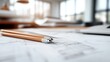 © Maximages  - An architect's desk is detailed with sharpened pencils and a focused blueprint, showcasing the meticulous process of planning, designing, and envisioning architectural projects.