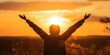 Silhouette of Hope: A woman's silhouette stands triumphantly against a breathtaking sunset, arms raised in a gesture of hope, freedom, and boundless potential. The warm glow of the setting sun symboli
