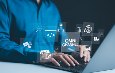 Wall Mural - omni channel marketing concept. businessman using laptop with digital icons representing omnichannel