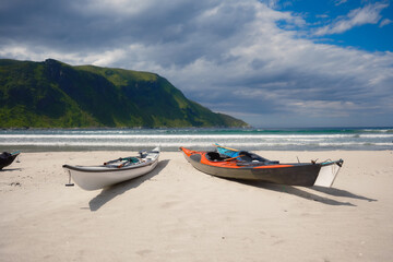 Wall Mural - kayaks on a sandy shore. water sports. active recreation and travel in summer time. norway. nature i
