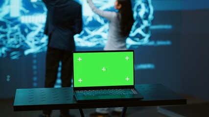Poster - startup coworkers using ai software on chroma key notebook to take data driven decisions. close up o
