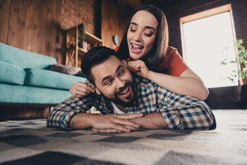 Wall Mural - Full size photo of young couple lying floor hugging move new place enjoy live together have fun new apartment room light house flat indoor