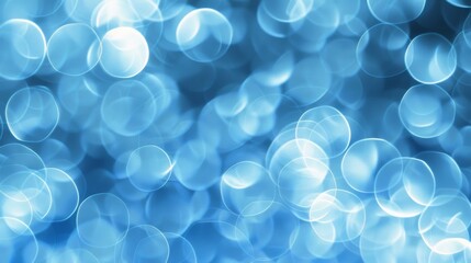 Poster - Abstract blue bokeh background with circular light patterns, dreamy and festive concept