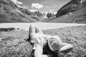 Poster - Person relaxing vacation on the coast of mountain lake