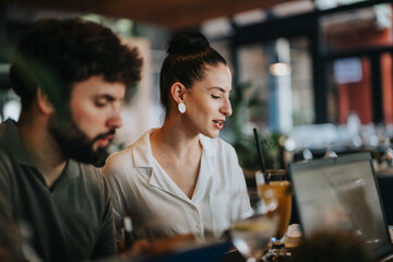 Wall Mural - Two businesspeople engage in a meeting at a coffee bar, discussing work and collaborating over drinks, showcasing teamwork and communication.