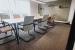 © qunica.com - Spacious and well-lit modern conference room featuring stylish chairs and a large table, ideal for business meetings and team collaborations.