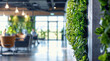 © oksa_studio - Environment concept. Green office space, Green living wall with modern office space blurred background, concept working environment