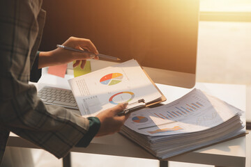 Team of business people working together in the meeting room office, teamwork background charts and graphs banner, double exposure successful teamwork,business planning concept.