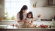 © Niks Ads - Indian mom and small daughter cooking together happily.