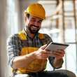 © takayuki - _Happy_construction_site_worker_using_digital_tabl