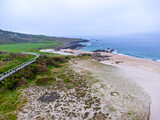 Fototapeta Pomosty - Aerial view, drone photo, ocean view in Portugal, beach in the morning, foggy day, seascape, camino road.