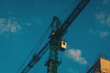 Construction crane on sky background. industrial crane. Construction site. Building.