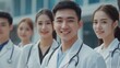 © atar - a group of asian young happy doctors smile